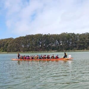 Erin racing with dragon boat team.